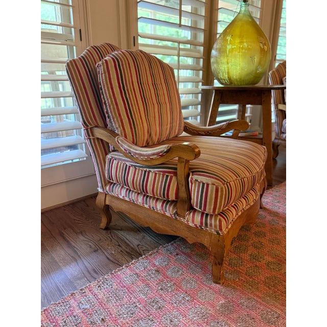 Bring timeless European charm and exceptional comfort to your home with this elegant pair of Louis XV-style bergère lounge...