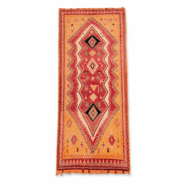 A distinctive vintage Moroccan Berber rug, handwoven in Morocco during the 1960s and distinguished by its warm saffron,...