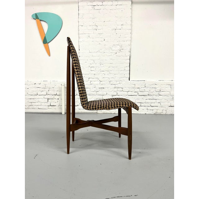 Lone high-backed dining chair that could easily work in other capacities like at a desk, across from a desk or next to an...