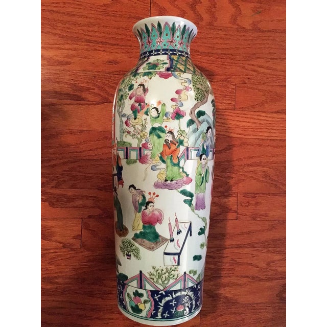 Vintage Chinese porcelain vase, circa mid 1980's. Masterfully hand painted with an imperial court scene encircling the...