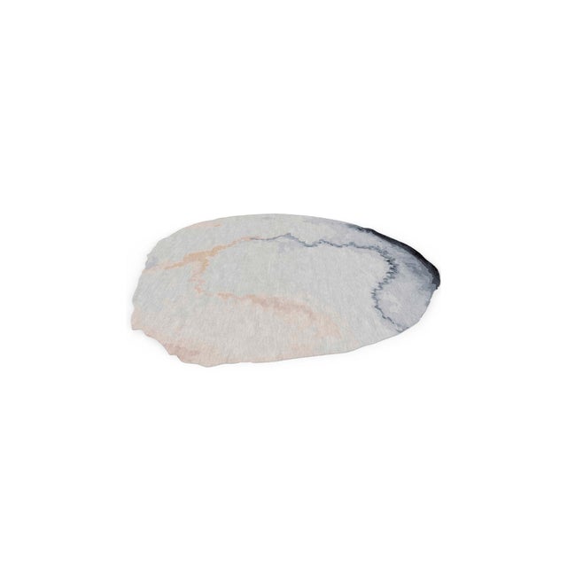 The enchanting rug Marietas was inspired by the round hole, a sort of open sun-drenched crate in the beach, which gives...