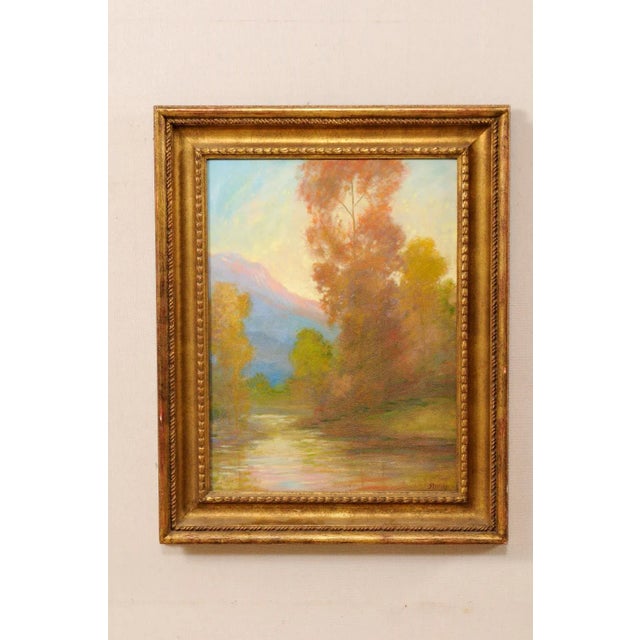 A David Stirling, American artist (1887-1971) landscape oil painting in frame. This is a romantic depiction of a water...