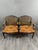 An elegant pair of late 19th-century armchairs in carved wood, with original caned backs. The curved lines, armrests, and...