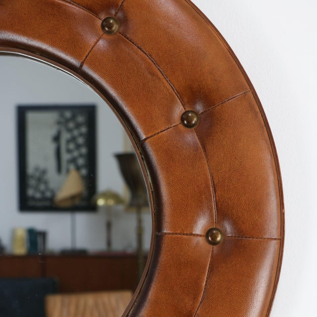 This refined circular wall mirror is an excellent example of Italian design from the 1970s, a period in which...