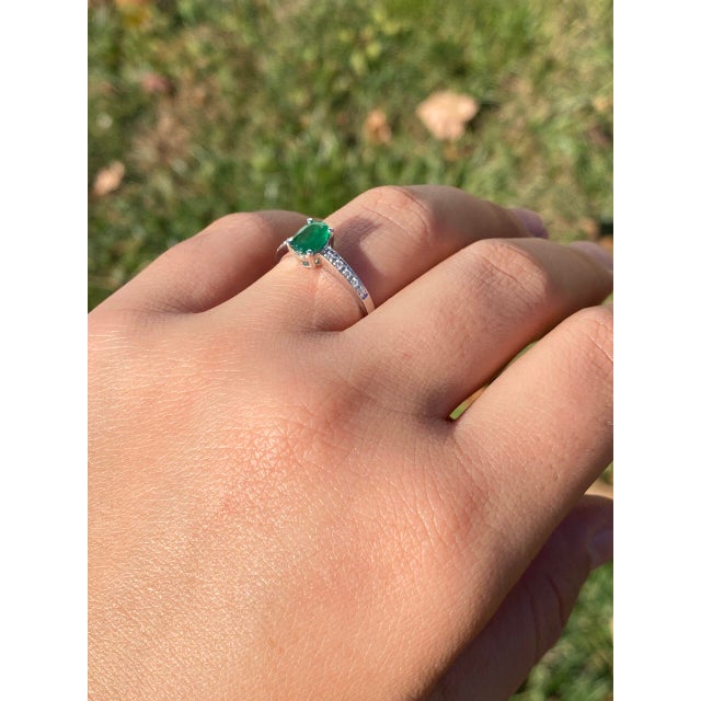 The 42nd Avenue: Emerald and Diamond Ring in White Gold. This ring highlights a centrally positioned 0.64-carat oval...