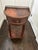 Elegant mahogany veneered demilune bedside or telephone table featuring a finely cast antiqued brass gallery above a...