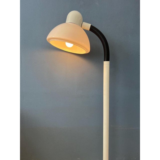 White mid century mushroom floor lamp by Hala Zeist. The white acrylic mushroom shade can easily be adjusted in position...