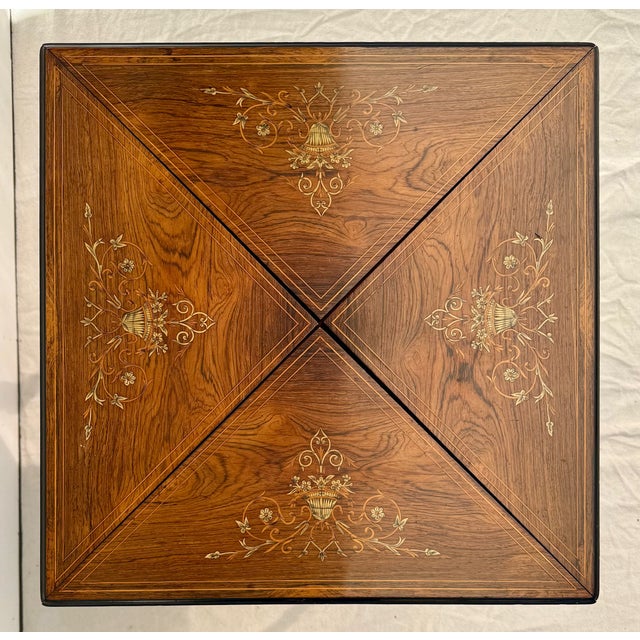 Here is an elegant antique Louis XVI style envelope folding game table, likely dating to circa 1890–1910, showcasing...