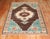 An intermediate-sized Turkish Kars rug in brown and pistachio dated 1968