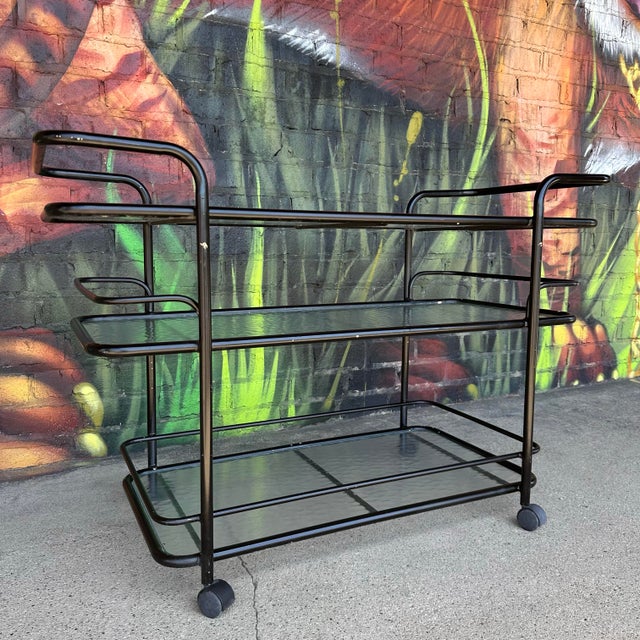 Mid century modern, Attributed to Brown Jordan tubular outdoor patio Bar Cart. This bar cart features a black painted...