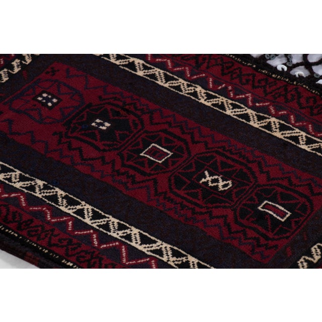 Hand-knotted in wool circa 1910-1920, this 2x3 Kilim is an antique Balisht textile—a collectible once used by nomadic...