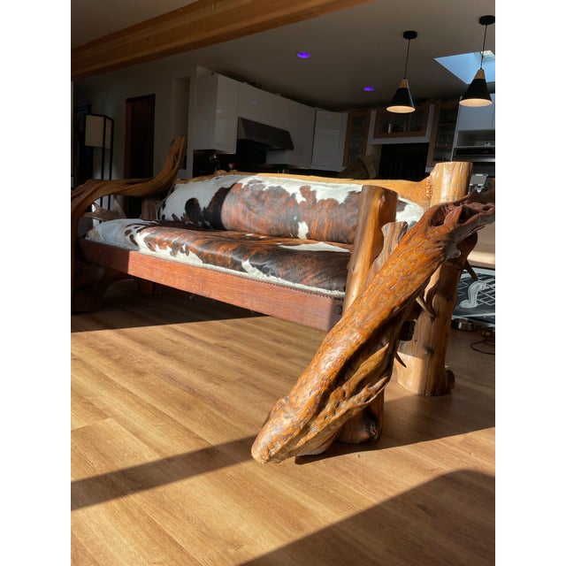 Handmade luxury real cowhide sofa with solid Wyoming mountain wood frame and antler back detail. One‑of‑a‑kind statement...