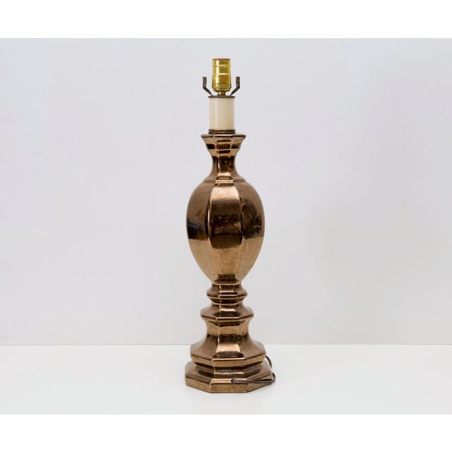 Simply gorgeous metallic bronze tone glaze makes this ceramic piece truly eye-catching. Likely made by Haeger Potteries....