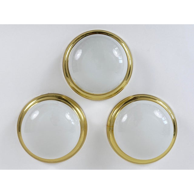 One of three elegant and minimalist mid-century modern ceiling lamps or sconces. Designed & manufactured in germany,...