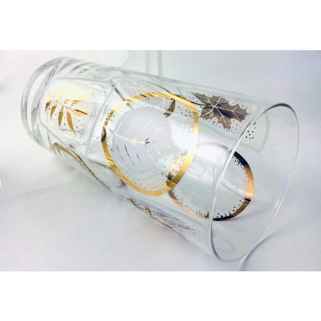 This set of 6 highball glasses features a playful alternating frond and panel theme in white and gold. Gold is in great...