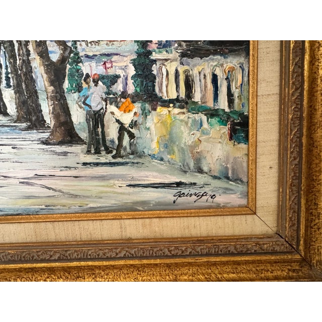 Painted on canvas using a palette and framed in a beautifully carved golden wood, the old world central park is tree-...