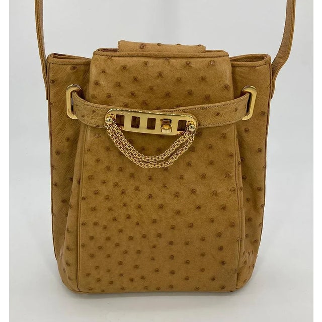 Vintage Judith Leiber Tan Ostrich Kelly Lock Handbag in excellent condition. Tan ostrich leather trimmed with gold...