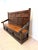 A beautiful antique solid oak monks bench featuring richly hand-carved panels and a practical lift-up seat with generous...