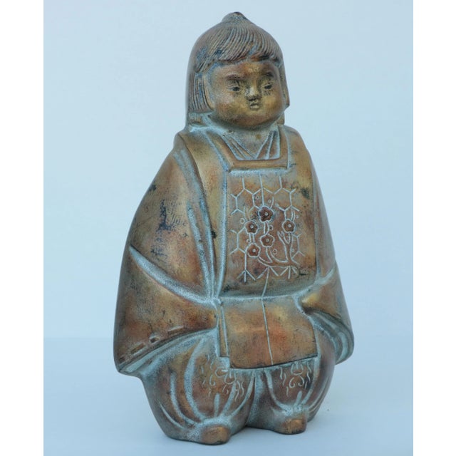Vintage lacquered bronze child figure with a sweet, expressive face. T