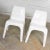 Handsome vintage pair of modern white molded plastic chairs in the style of Kartell’s 4850 chair designed by Giorgina...
