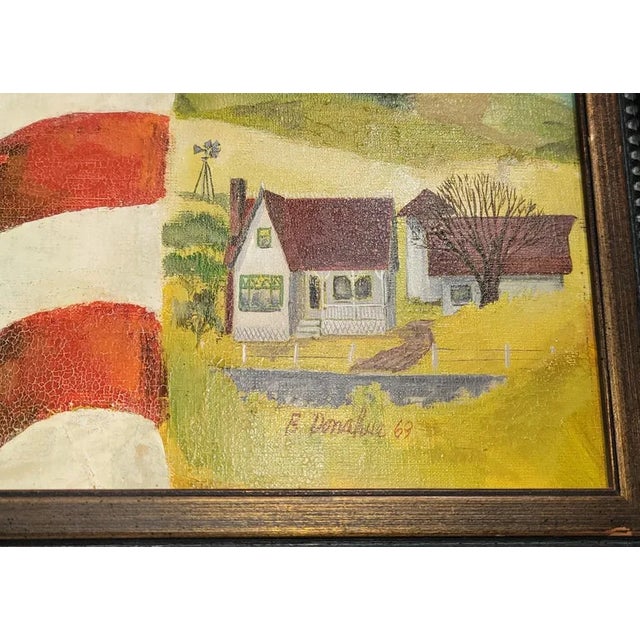 Signed B. Donahue and dated 1969 Patriotic Flag painting. On the left side a cemetery honoring fallen heroes in war. To...