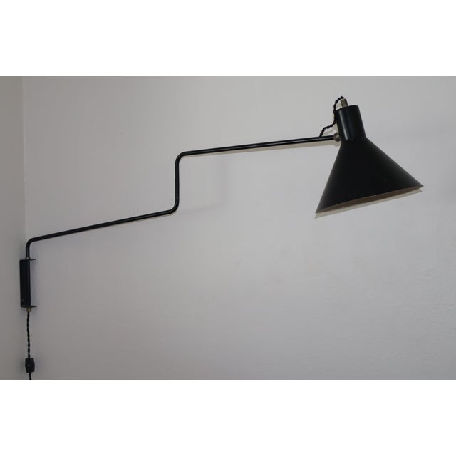 A vintage articulating wall sconce by J. Hoogervorst for Anvia Almelo, Netherlands, 1950s. Newly rewired for U.S standards...