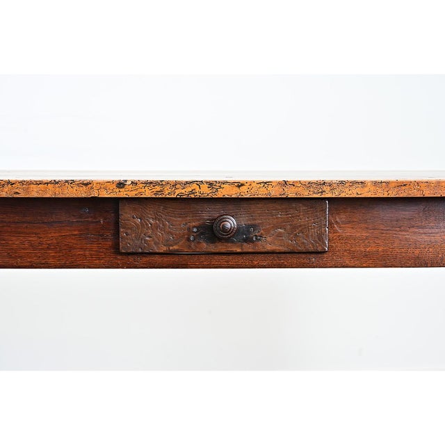 This modest console table, or server, is hand-crafted of solid walnut dating to circa 1860 France. The planks of the top...