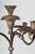 A wonderful pair of hand carved and gilded torcheres with handwrought iron candle arms and bobeches. The candelabra...