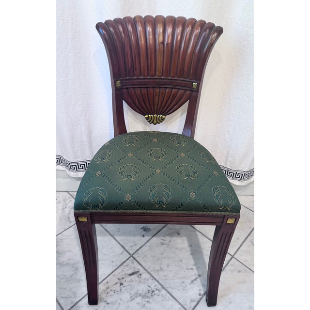 Beautiful pair of fan back dining chairs by renowned manufacturer Maitland - Smith. Features a mahogany frame, ornate...