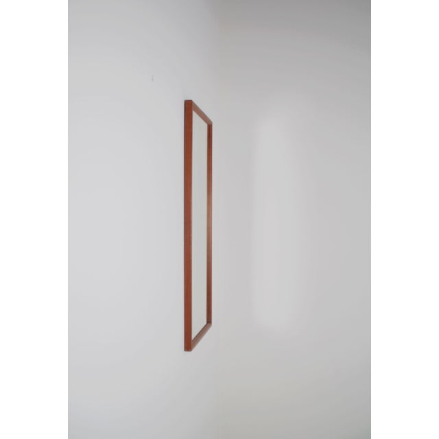 Danish mirror designed by Kai Kristiansen in the 1960s. It was manufactured in teak by the well-known manufacturer Aksel...