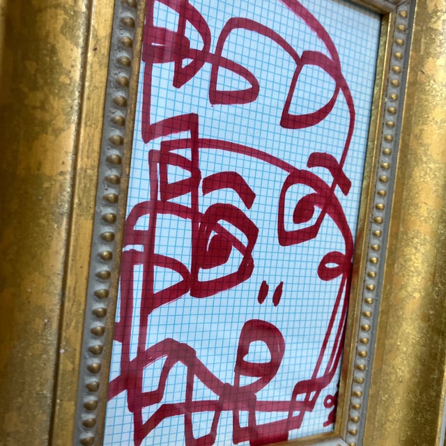 Original 5 x 8 red marker drawing done on vintage blue gridded paper signed Overall size with new old stock frame is 9 x 12