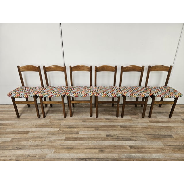 Refined set of 1950s chairs for the dining room, solid and robust, they have a beech structure and seat covered in vintage...