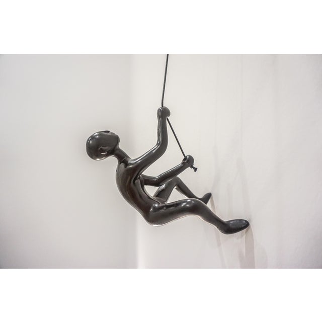 Our Deep Chocolate-Black Climbing Man is a beautiful addition to your wall decor! Curate your own collection with our...