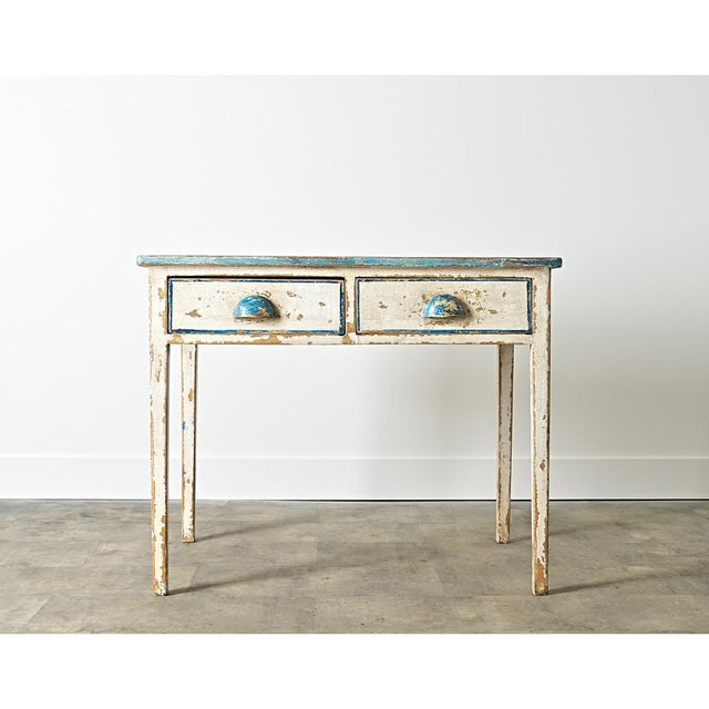 English, 19th century kitchen table with charming hand-painted top to appear as if covered with Delft tiles. An otherwise...
