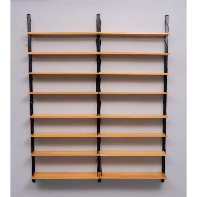Iconic Poul Cadovius Royal wall system. Three uprights and comes with 16 Beechwood shelves , complete with all the...