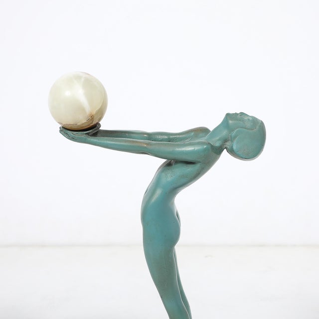 This captivating Art Deco sculpture, titled "LUEUR" by the esteemed artist Max Le Verrier, epitomizes the elegance and...