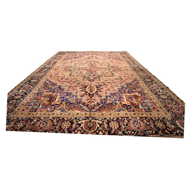 Condition: Vintage Circa: 2000s Origin: Persia Design: Heriz Actual Size: 12'10" x 19'5" Color: Red, Orange, Black,...