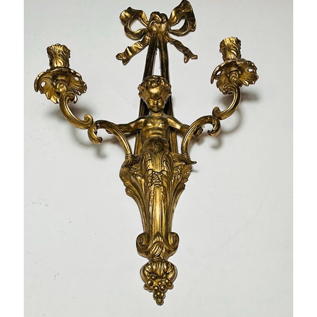 Early 20th Century Early 20th Century Pair of Monumental 22” French Louis XVI Style Gilt Bronze Cherub Two-Light Wall Sconces With Ribbon Bows For Sale - Image 5 of 7
