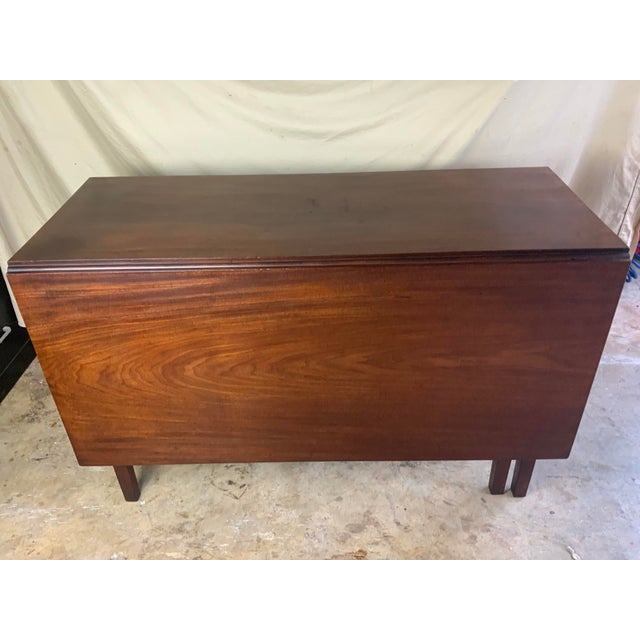 A very nice clean early Mahogany swing leg dining table with one board leaves and top board with exceptional grain and...