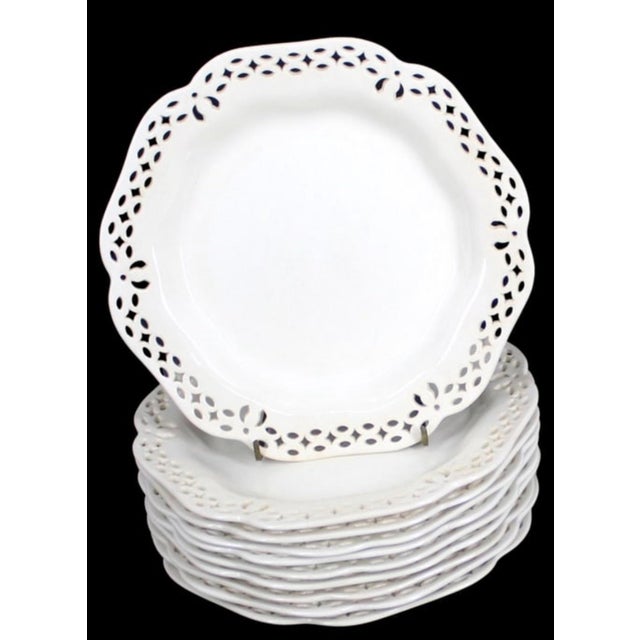 A lovely set of ten vintage Wedgwood cream reticulated plates featuring an elegant pierced openwork border and softly...