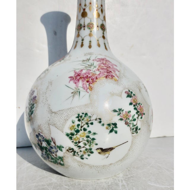 Japanese studio porcelain vase from the Meiji period. Beautiful painted details of tiny floral designs over the entire...