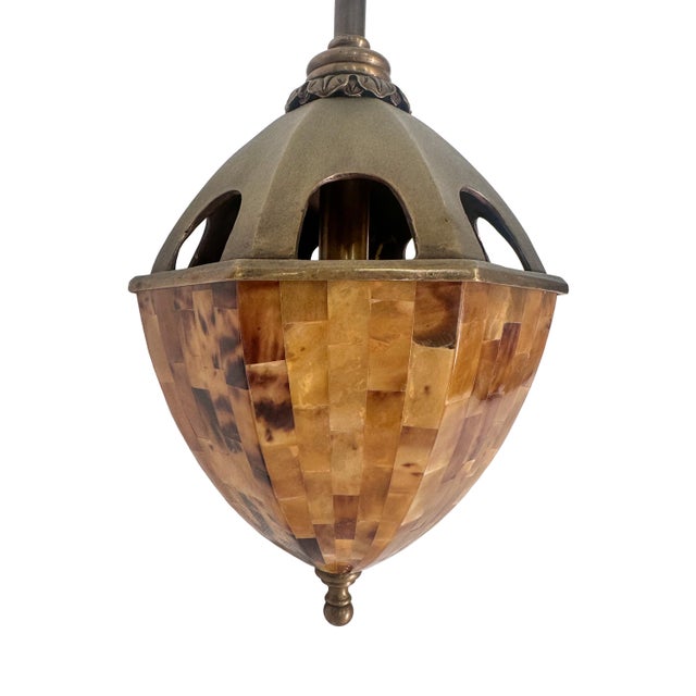 Gorgeous luxury pendant lights featuring tessellated pen shell housing and brass hardware. These are very well-made...