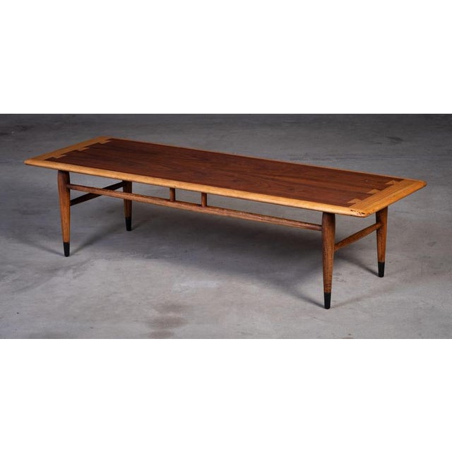 Elegant mid-century coffee table designed by Dutch designer Andre Bus and produced by Lane Acclaim in the 1960s. Crafted...