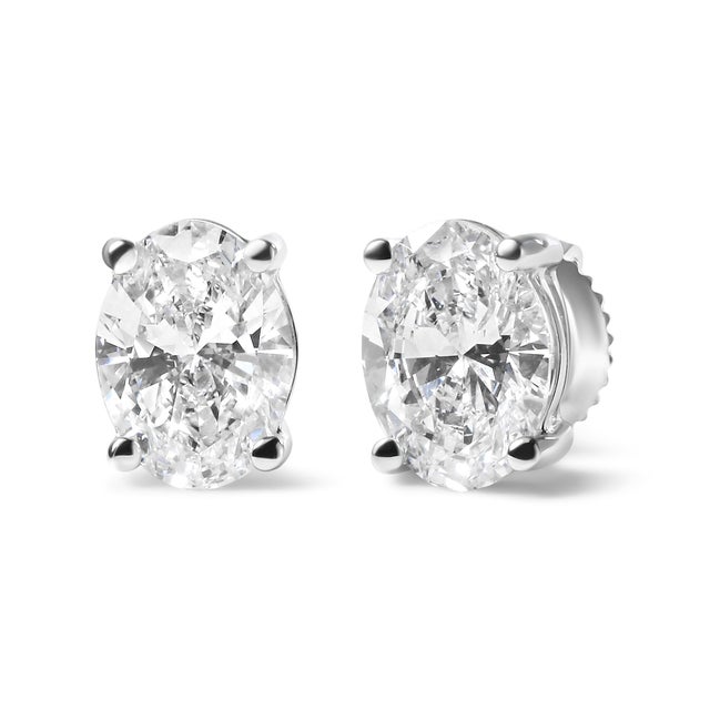 Indulge in the ultimate luxury with these breathtaking lab-grown diamond solitaire stud earrings. Crafted from gleaming...