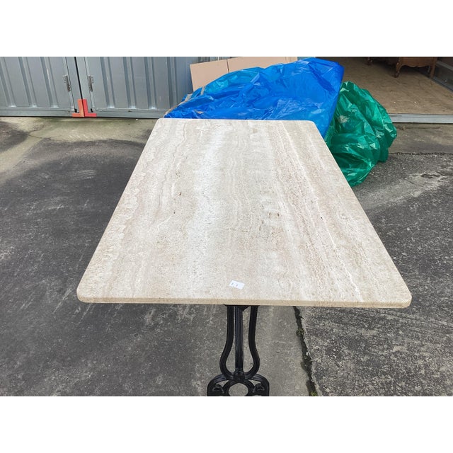 Classic and elegant best describe this French Bistro table. With an ornate wrought iron base, this table features a solid...