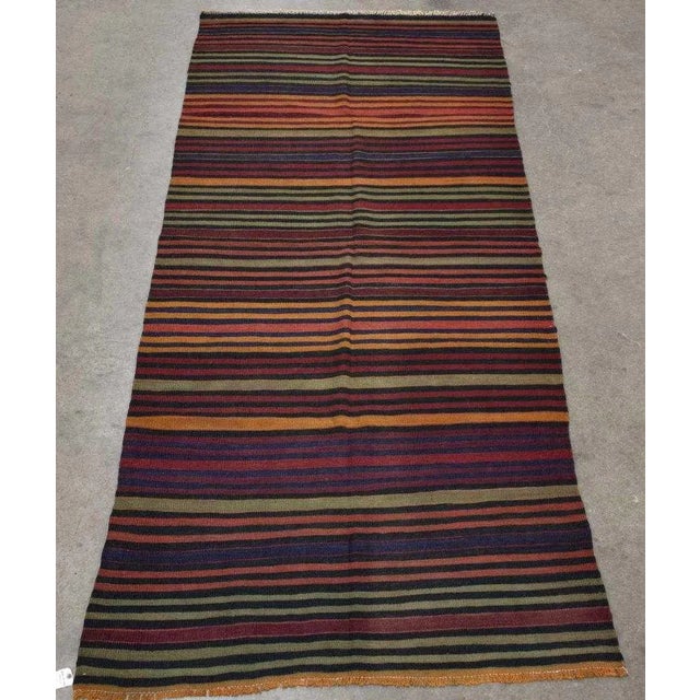 An absolutely beautiful vintage Cicim, hand-tied in Anatolia, Turkey in the early 20th century. A great benefit of a...