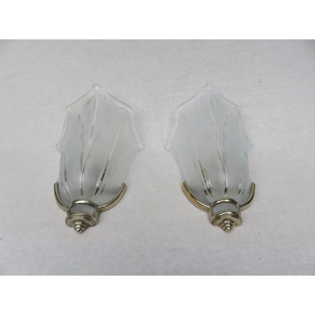 - Wall lights with the marking Ezan France -Glass shades made from pressed matte glass with clear glass - Wall mounts made...