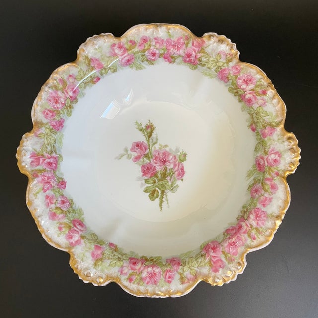 A lovely antique Jean Pouyat serving bowl in the POY141 pattern. The interior features a central spray of roses surrounded...