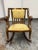 Design Plus Gallery presents a Vintage Empire Style Wood Rocking Armchair. The sculptural wood frame displays sweeping...