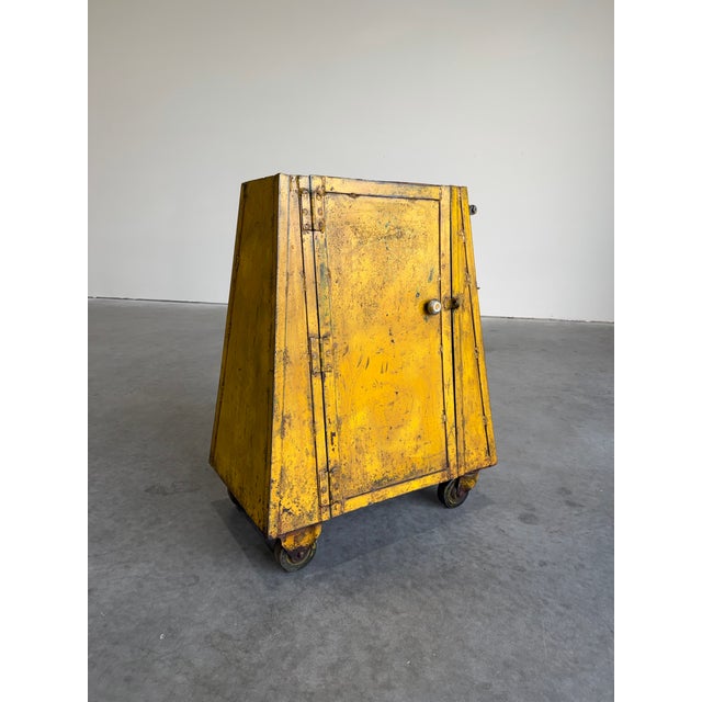 Vintage rustic primitive industrial metal machine or parts cabinet on wheels. Excellent aged patina to the yellow exterior...